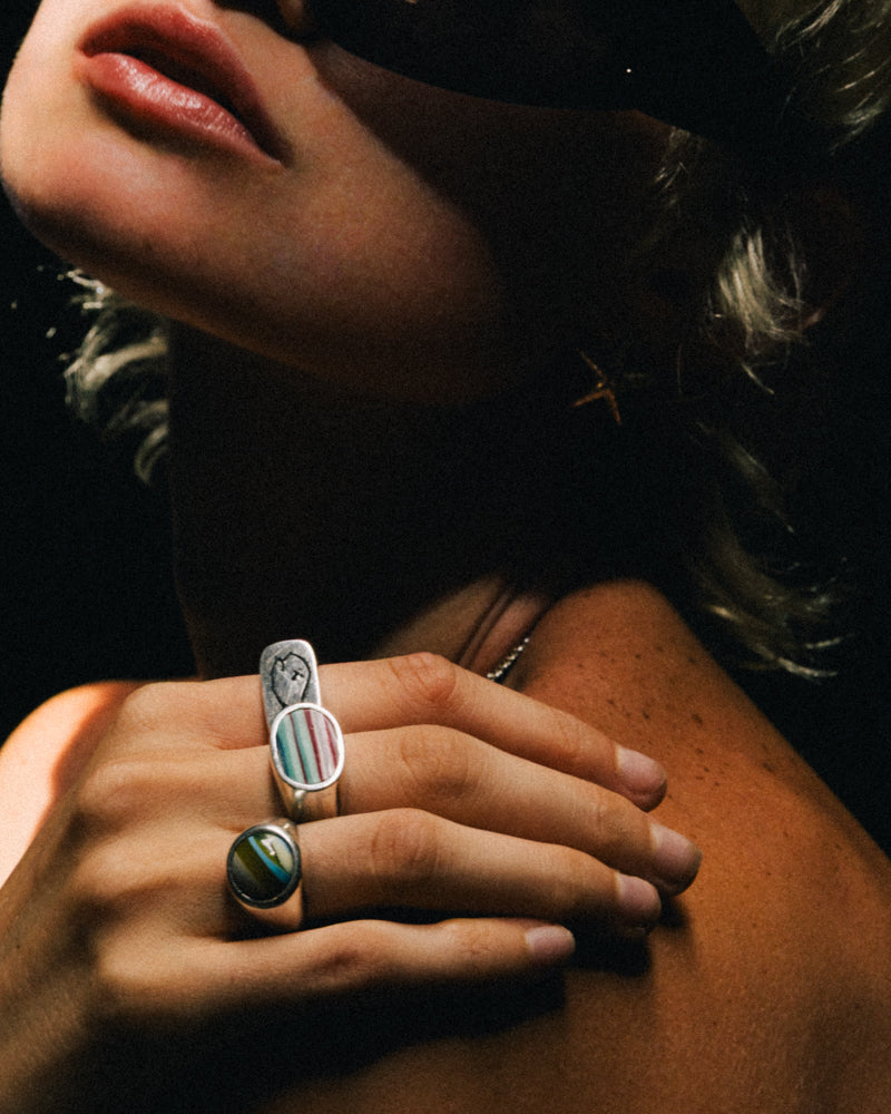 SURFITE RING LIFESTYLE PRODUCT PHOTO; also highlights the BADFISH RING, and the Cabacon Surfite ring.