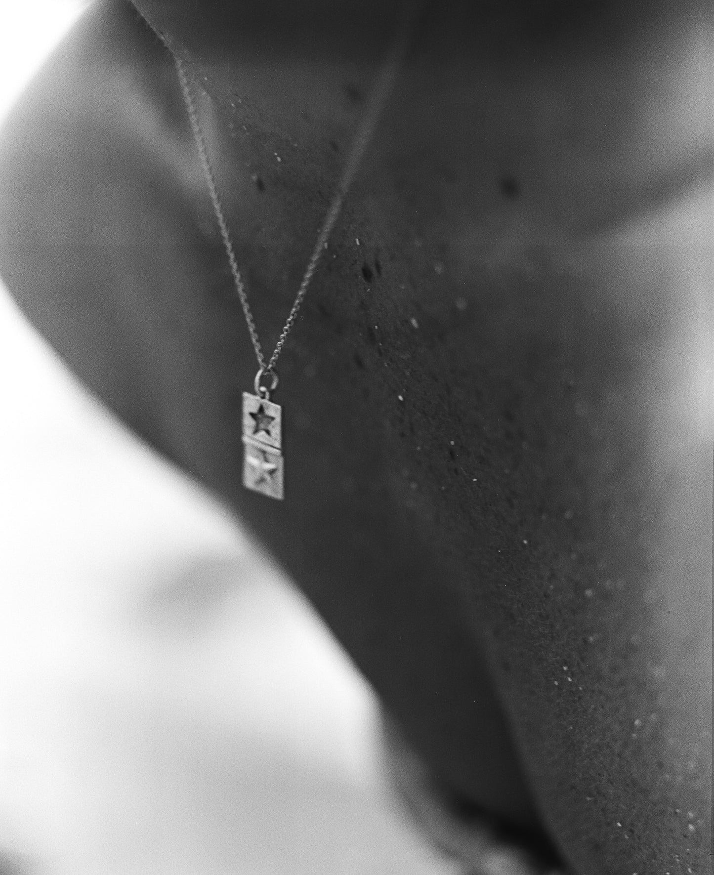 Lifestyle shot of Handmade 925 Sterling Silver Two Star Pendant on a Silver Chain