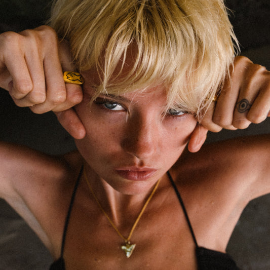 Badfish Model Brooke wearing Gold Handmade Jewelry - Wearing Sharktooth Pendant Necklace in Gold and Badfish Ring in Gold.
